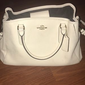 Coach purse with cleaner